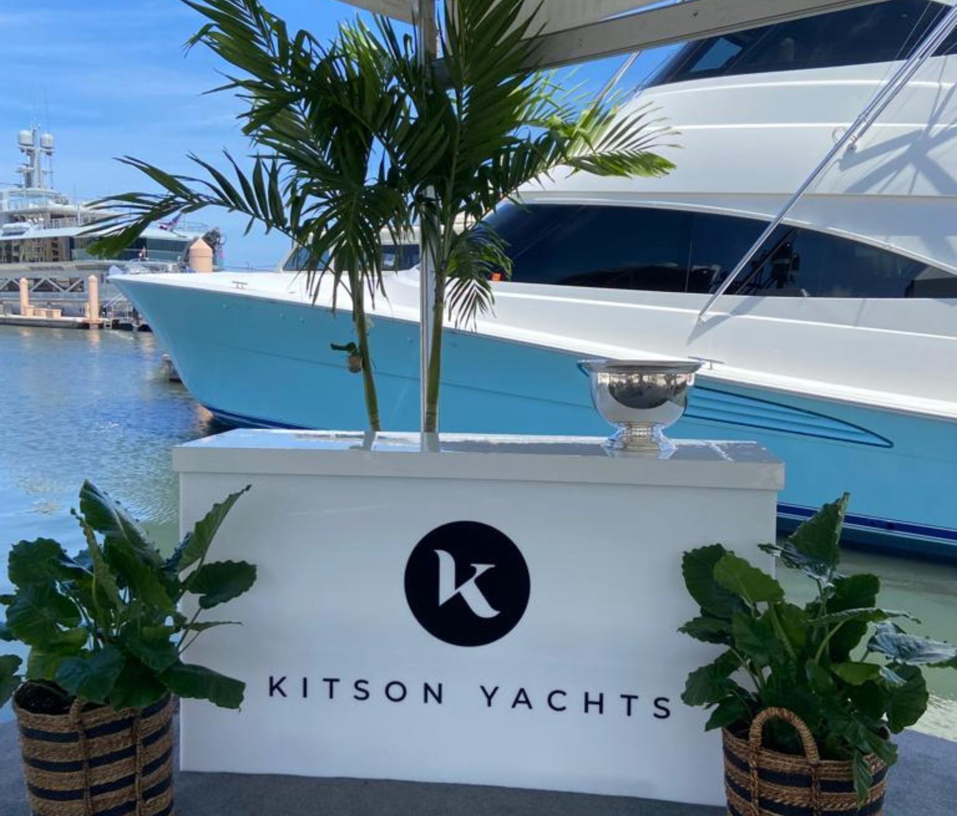 Kitson yachts showcasing the best Caribbean yacht charter destinations at the Florida boat show.