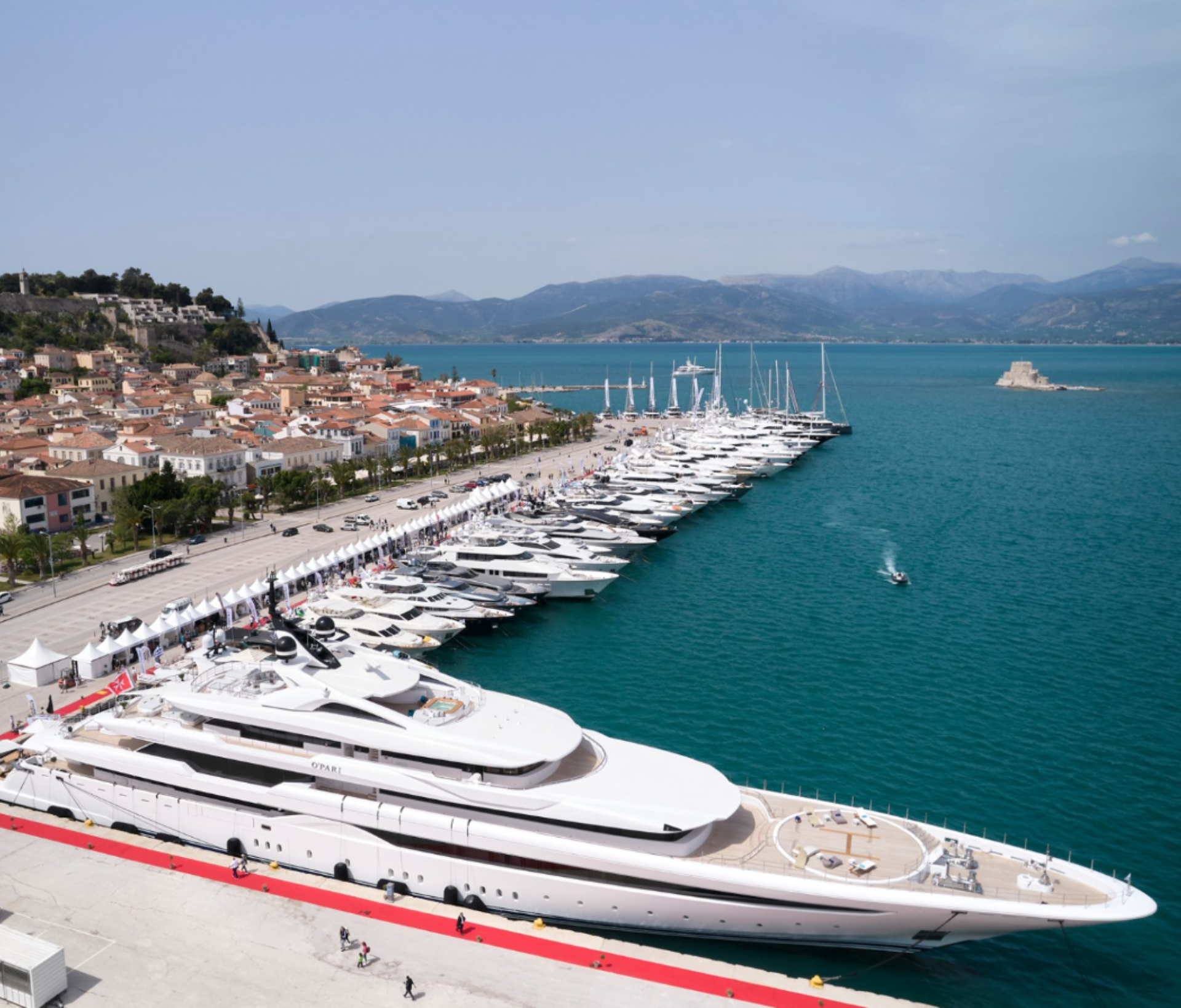 A large yacht docked at a marina in the Caribbean.