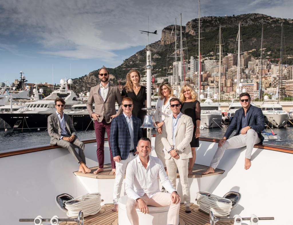 A group of people posing on a Caribbean yacht charter.